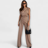 Set with asymmetric design and dramatic shoulders