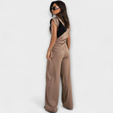 Set with asymmetric design and dramatic shoulders