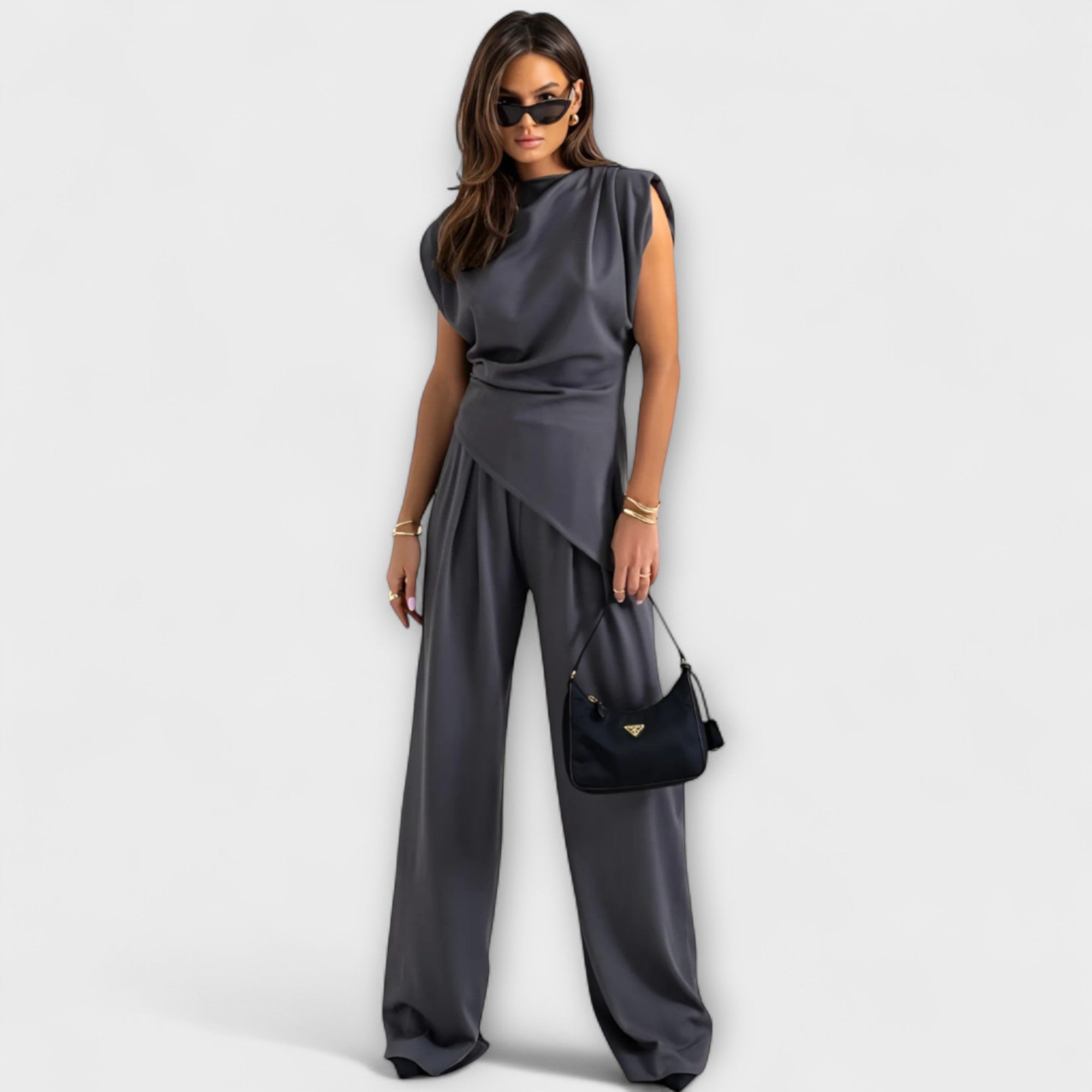 Set with asymmetric design and dramatic shoulders