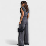 Set with asymmetric design and dramatic shoulders