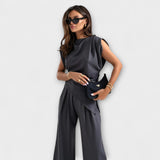 Set with asymmetric design and dramatic shoulders