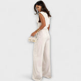 Set with asymmetric design and dramatic shoulders