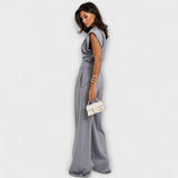 Set with asymmetric design and dramatic shoulders