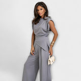 Set with asymmetric design and dramatic shoulders