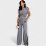 Set with asymmetric design and dramatic shoulders