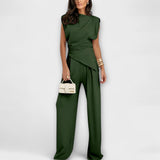Set with asymmetric design and dramatic shoulders