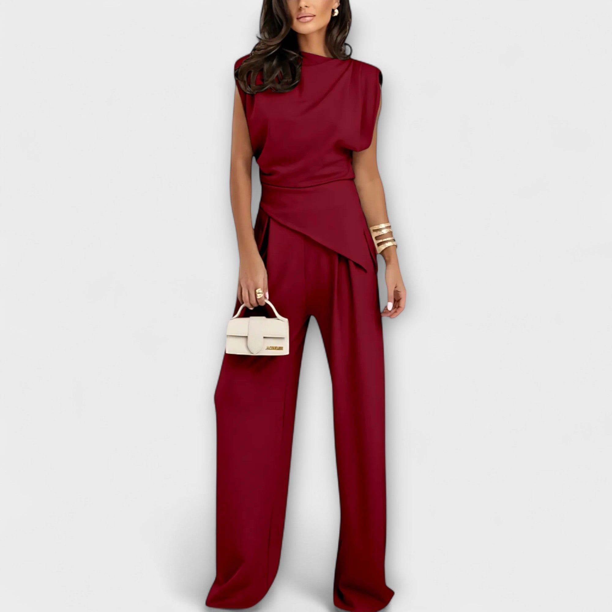 Set with asymmetric design and dramatic shoulders
