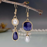Elegant earrings with a blue stone and pearl